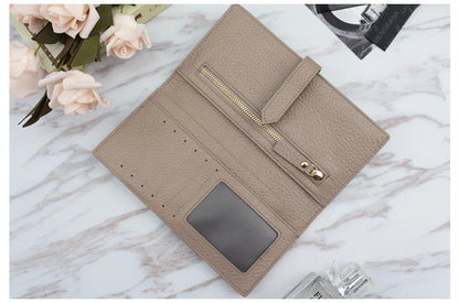 A stylish and practical long wallet made from premium leather, featuring a convenient drawstring closure to keep your essentials organised and secure.