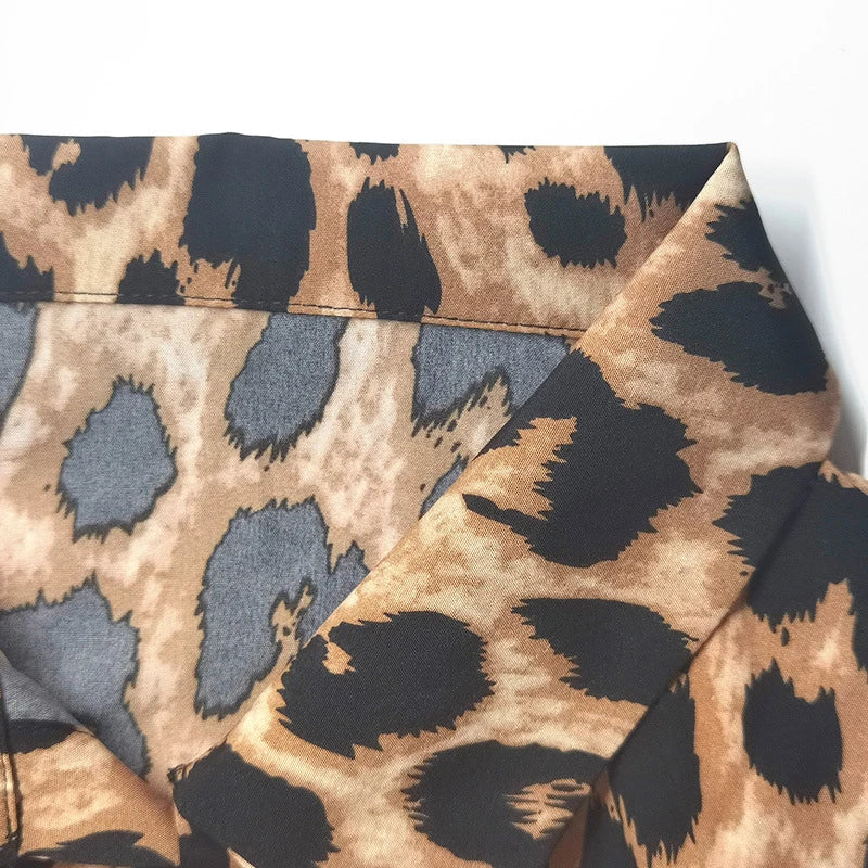 Elegant leopard print beach cover-up robe with V-neck and side pockets, perfect for summer vacations and beach parties.