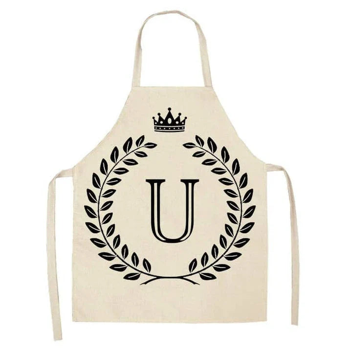 A high-quality kitchen apron featuring a charming crown and letter print design in a premium cotton and linen blend fabric.