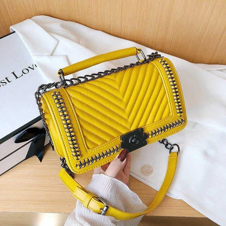 Fashionable leather messenger bag with chain strap in a range of vibrant colours, designed for style and functionality