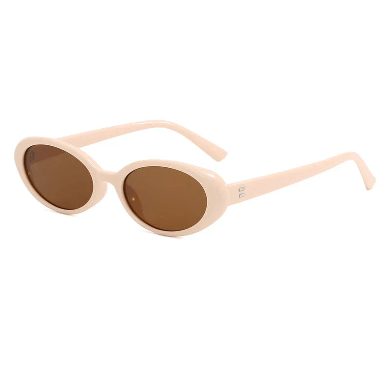 Oval-shaped women's sunglasses in a white and grey colour, offering UV protection and a stylish, retro-inspired design.