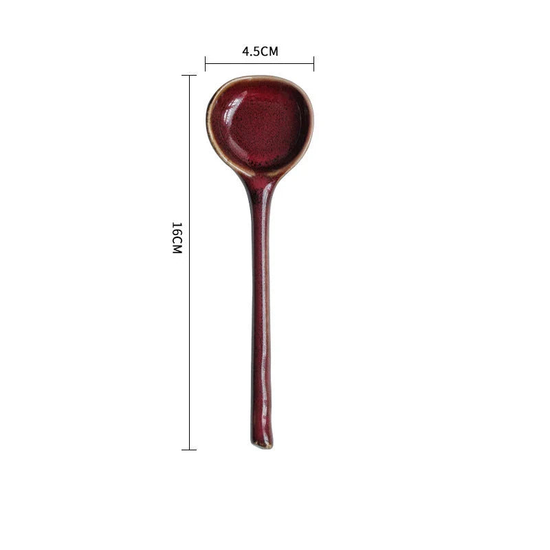 Elegant ceramic soup spoon with long handle and vibrant grey glaze, perfect for refined dining experiences