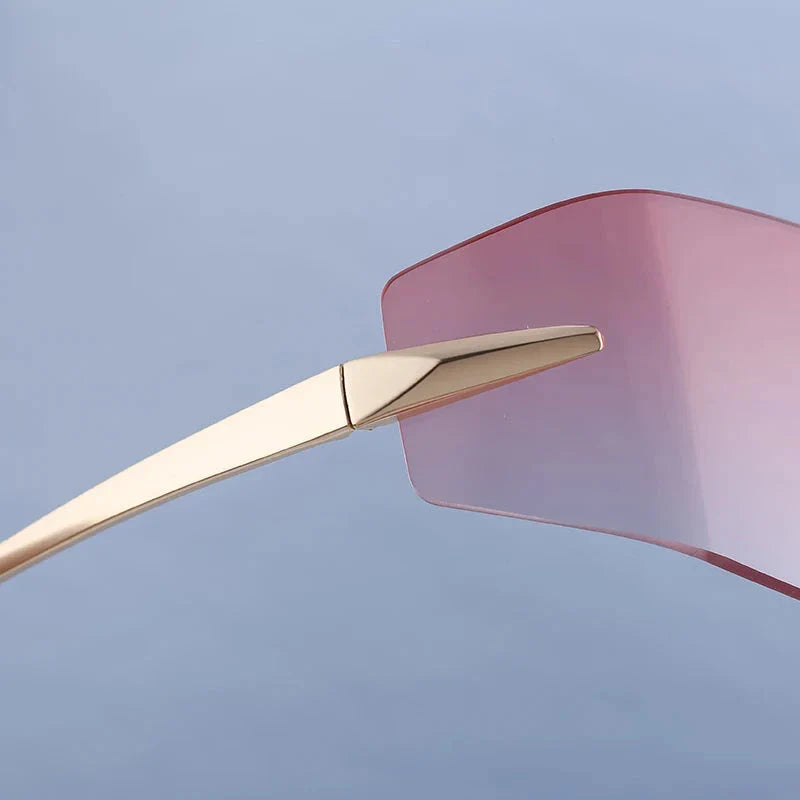 Elegant rimless rectangular sunglasses with a sleek, minimalist design and contemporary silhouette