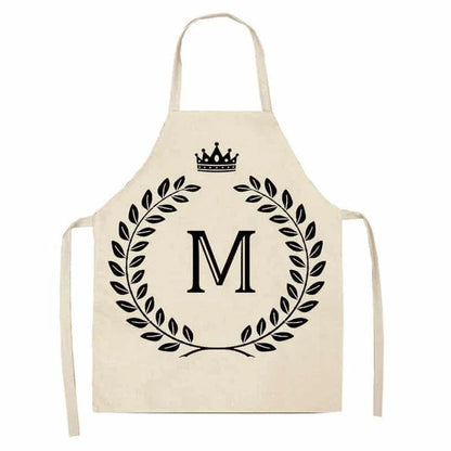 A high-quality kitchen apron featuring a charming crown and letter print design in a premium cotton and linen blend fabric.