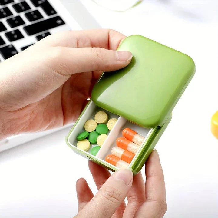 Compact push-pull pill case organiser in various vibrant cartoon-inspired colours for convenient medication management