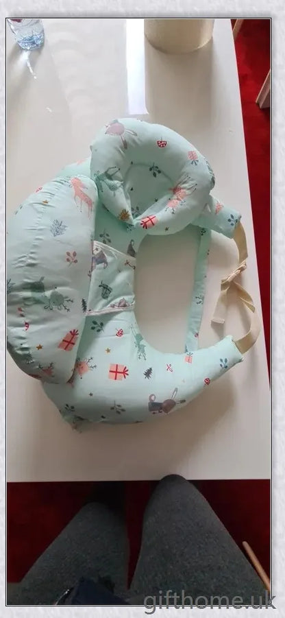 Premium breastfeeding nursing pillow with adjustable buckle, soft cotton fabric, and extra cushioning to support baby's head and prevent reflux.
