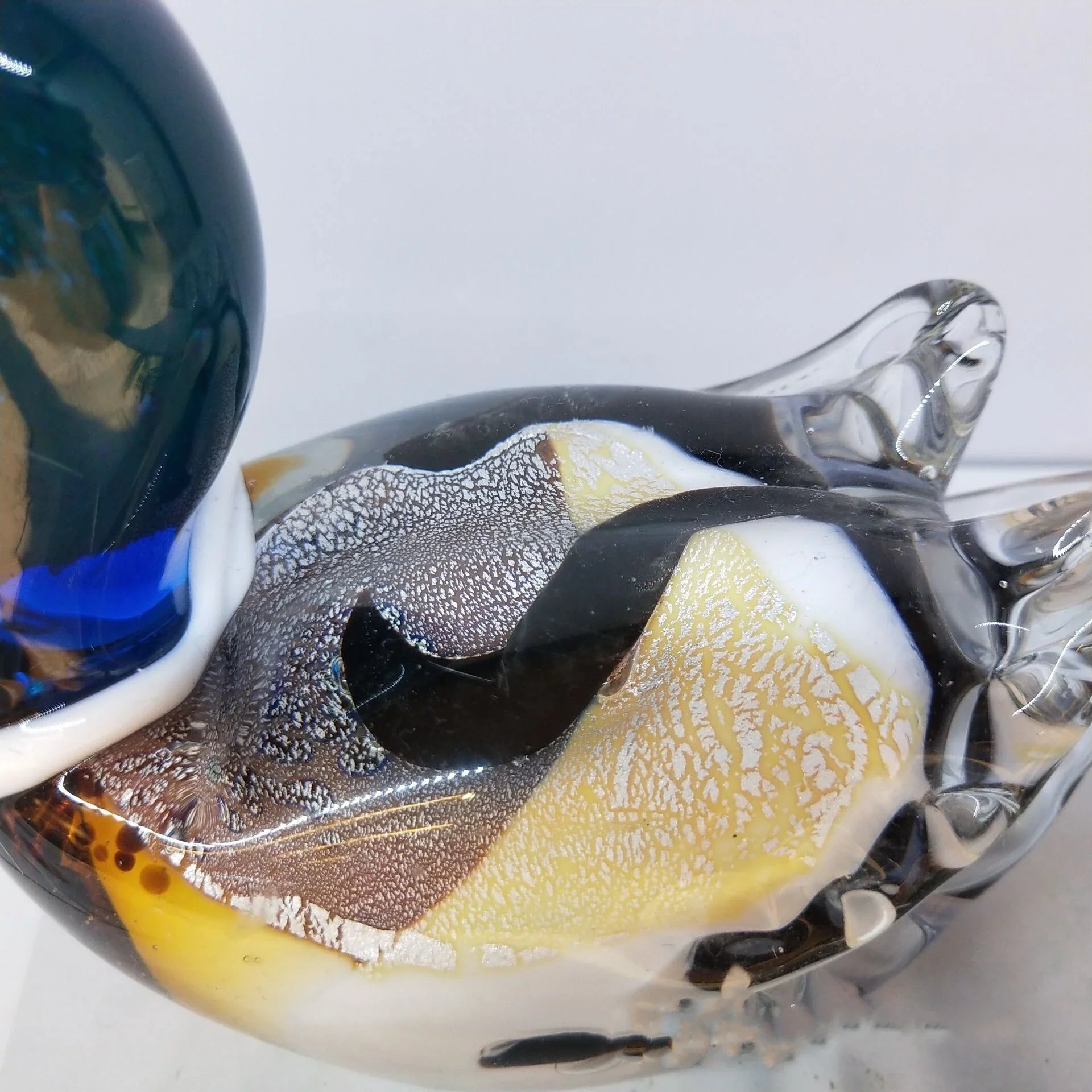 Handcrafted glass ornament in the shape of a Mandarin duck with vibrant colours and intricate details