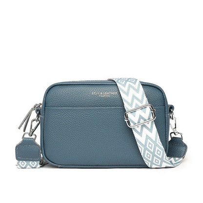 Stylish leather crossbody bag with embroidered strap in various colours