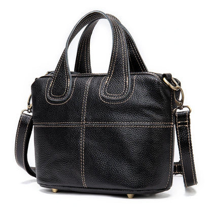 Premium leather shoulder bag for women in red, blue, and black colours with spacious interior and comfortable strap
