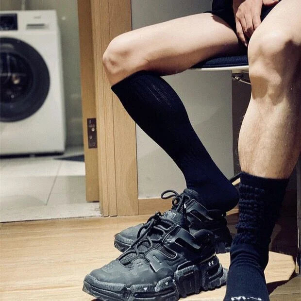 Premium men's breathable terry socks in various solid colours, offering superior moisture-wicking and comfort