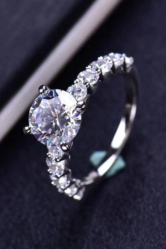 Exquisite 2-carat moissanite solitaire ring in 925 sterling silver, featuring a mesmerising centre stone and delicate metalwork for a modern, minimalist design.