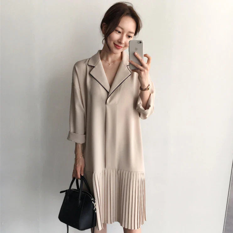Premium Pleated Suit Dress in Timeless Beige featuring a V-neck, long sleeves, and a mid-length skirt with unique fold stitching detail