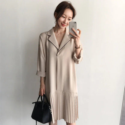 Premium Pleated Suit Dress in Timeless Beige featuring a V-neck, long sleeves, and a mid-length skirt with unique fold stitching detail