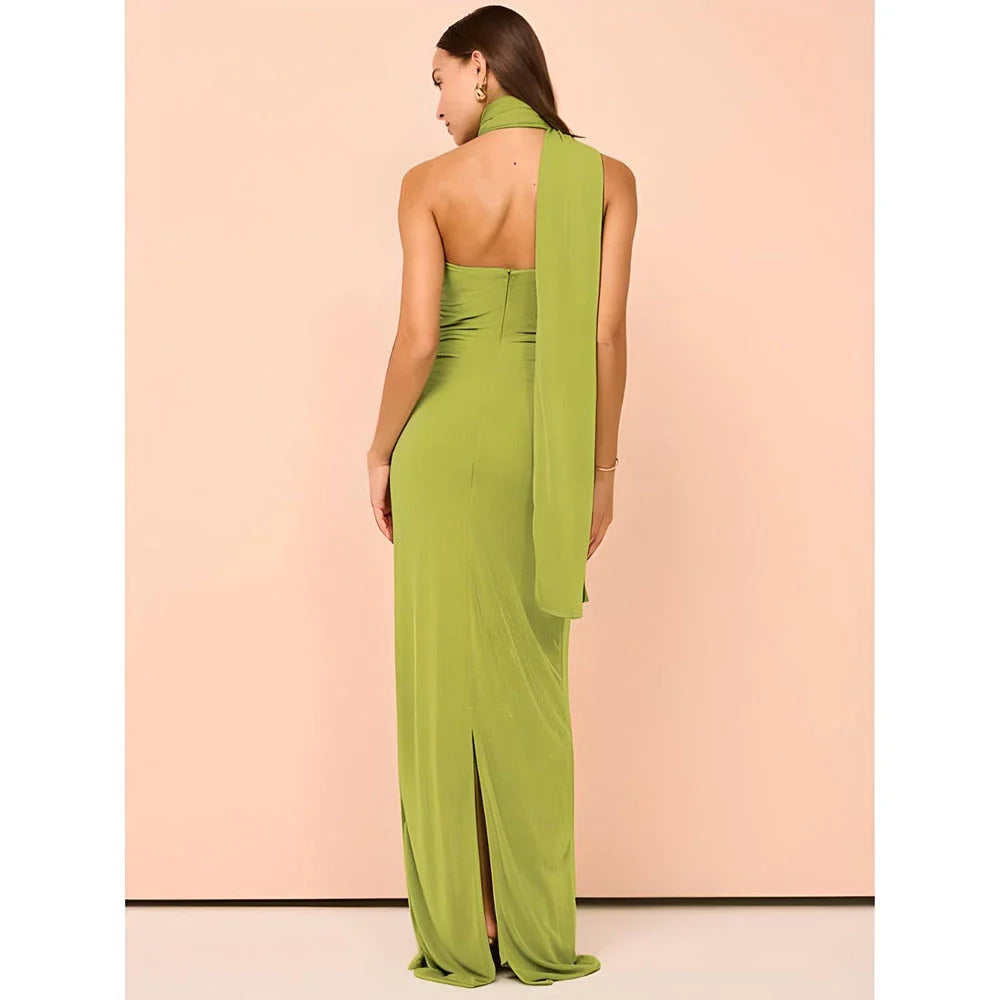 Elegant halter backless ankle-length bodycon dress in a solid colour, designed to flatter the figure and create a sophisticated, eye-catching look for formal events.