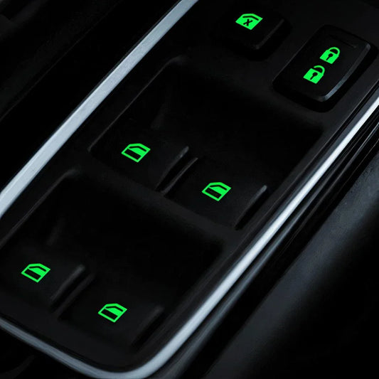 Fluorescent car button stickers emitting a bright green glow for easy visibility in the dark