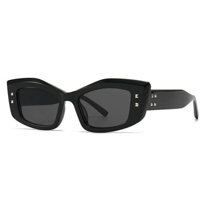 Retro cat eye sunglasses with rivet details, offering a stylish and protective eyewear solution.