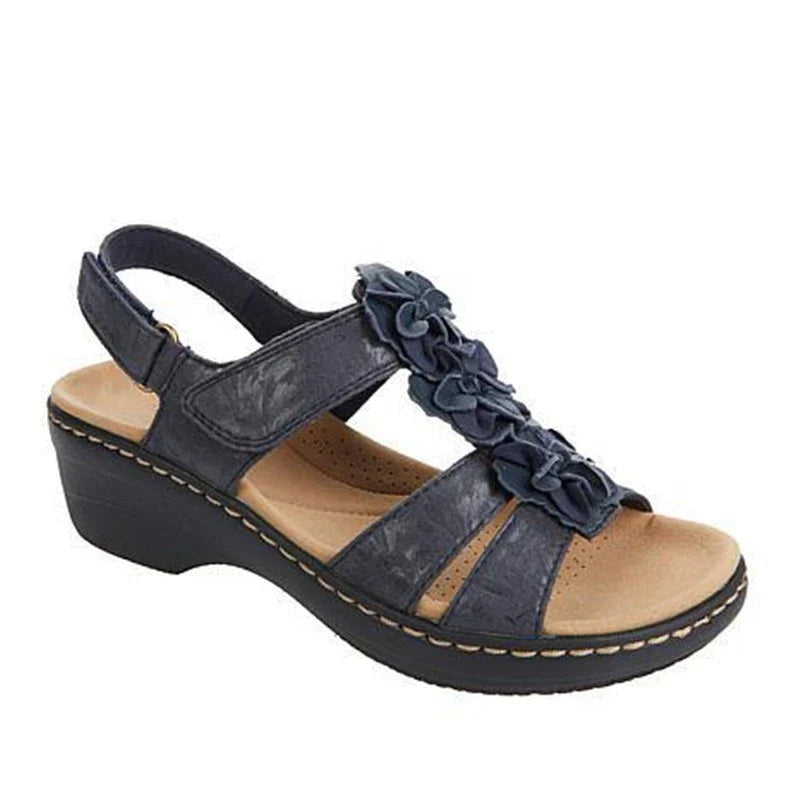 Stylish wedge sandals in a range of vibrant colours, featuring a chic fish mouth design and delicate flower accents for a modern, casual-chic look.