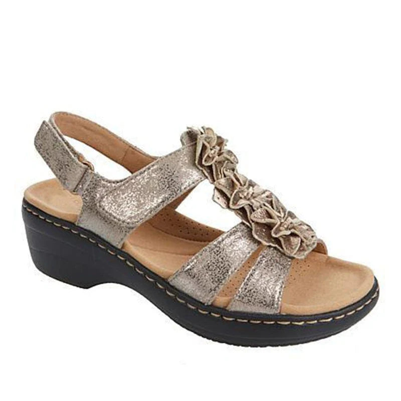 Stylish wedge sandals in a range of vibrant colours, featuring a chic fish mouth design and delicate flower accents for a modern, casual-chic look.