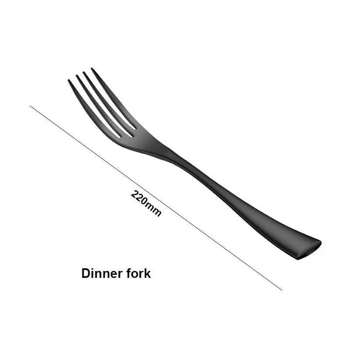 A stylish set of black stainless steel flatware, including a teaspoon, knife, and fork, on a white background.