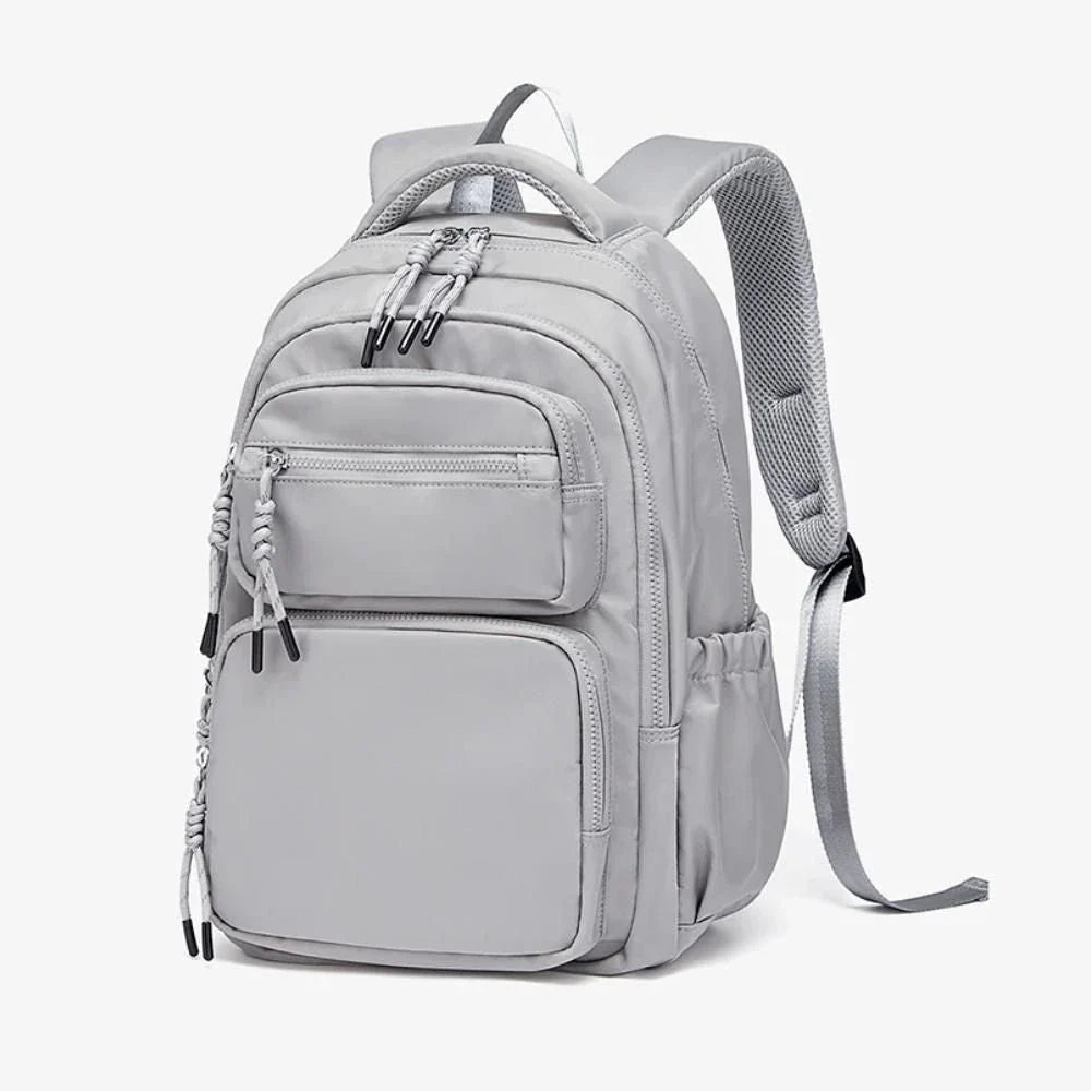 Premium leather backpack with dedicated laptop compartment, soft handles, and arcuate shoulder straps for modern women