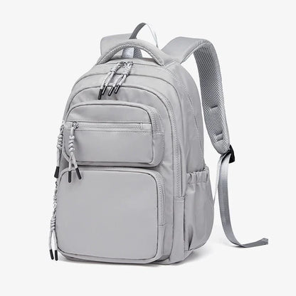 Premium leather backpack with dedicated laptop compartment, soft handles, and arcuate shoulder straps for modern women