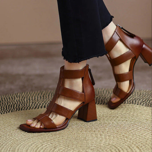 Luxurious leather gladiator sandals with square heel and buckle strap, providing style and comfort for any occasion.
