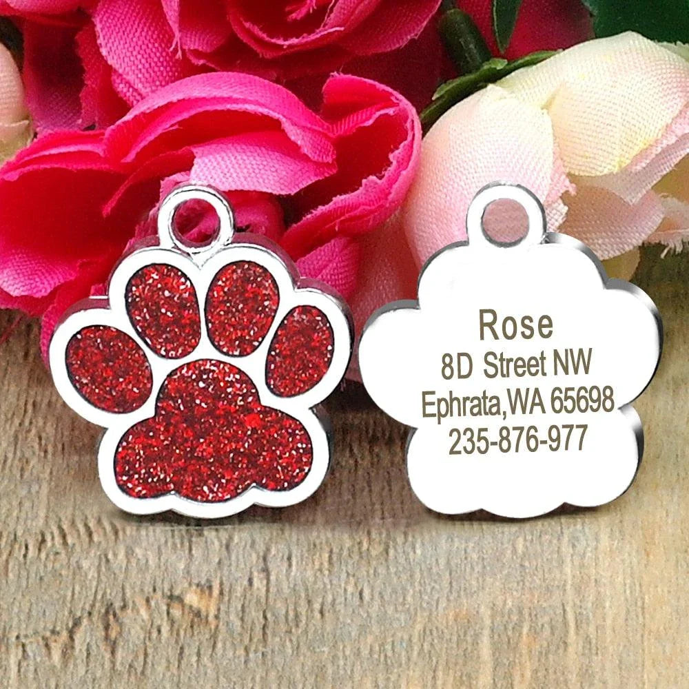 Paw-shaped pet ID tag with rhinestone embellishments, designed for safety and style