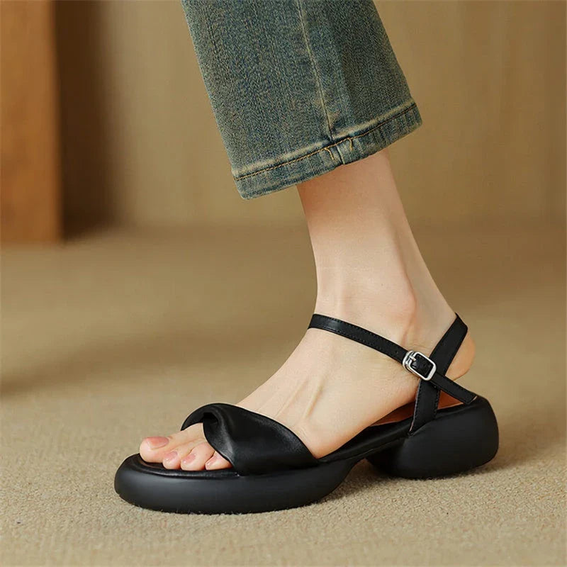 Premium leather chunky heel sandals in black with adjustable buckle strap for comfortable, stylish summer wear