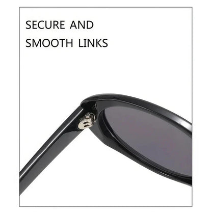 Oval-shaped women's sunglasses in a white and grey colour, offering UV protection and a stylish, retro-inspired design.