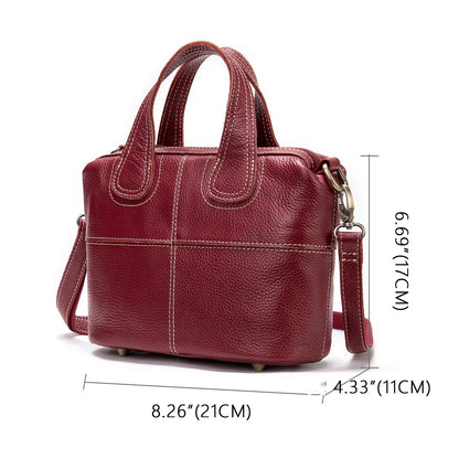 Premium leather shoulder bag for women in red, blue, and black colours with spacious interior and comfortable strap