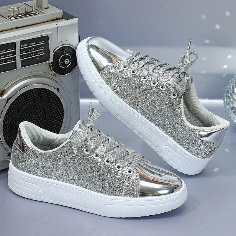 Glittering sequin flats with thick soles and lace-up closure in various vibrant colours