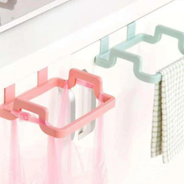 Cupboard-mounted trash bag holder in various colours for organising kitchen waste storage