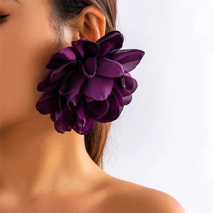Exquisite fluffy fabric flower stud earrings in a black metal colour, featuring oversized fabric blooms for a unique and elegant design.