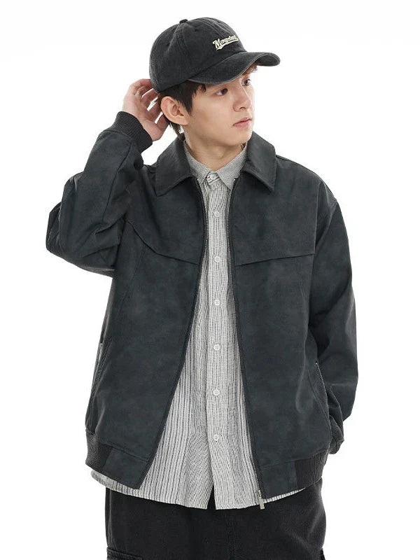 A classic distressed leather jacket in a relaxed, unstructured fit suitable for both men and women