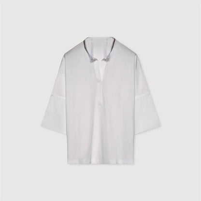 Stylish bead-embellished split-hem t-shirt in white, designed for the modern British woman with a touch of elegance and comfort.
