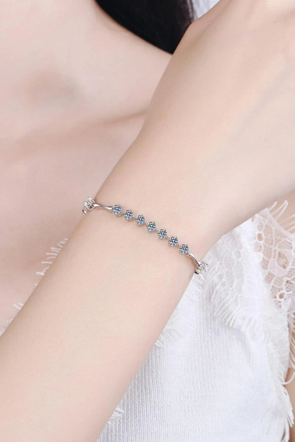 Elegant moissanite and sterling silver bracelet with a rhodium plated finish, designed for sophisticated style.
