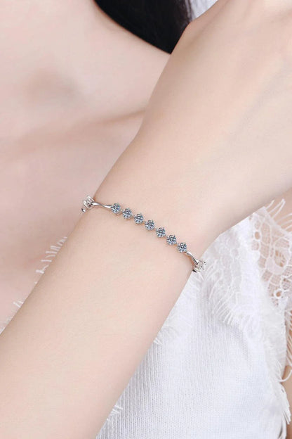 Elegant moissanite and sterling silver bracelet with a rhodium plated finish, designed for sophisticated style.