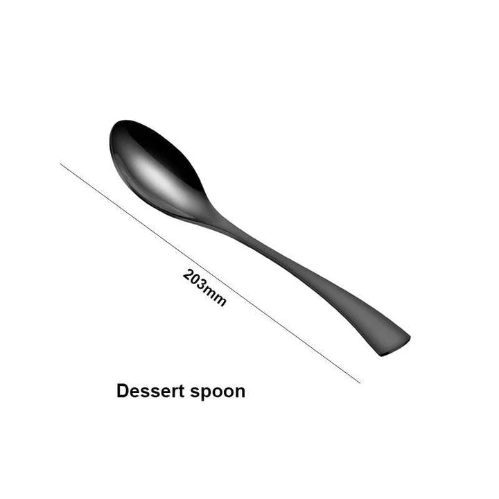 A stylish set of black stainless steel flatware, including a teaspoon, knife, and fork, on a white background.