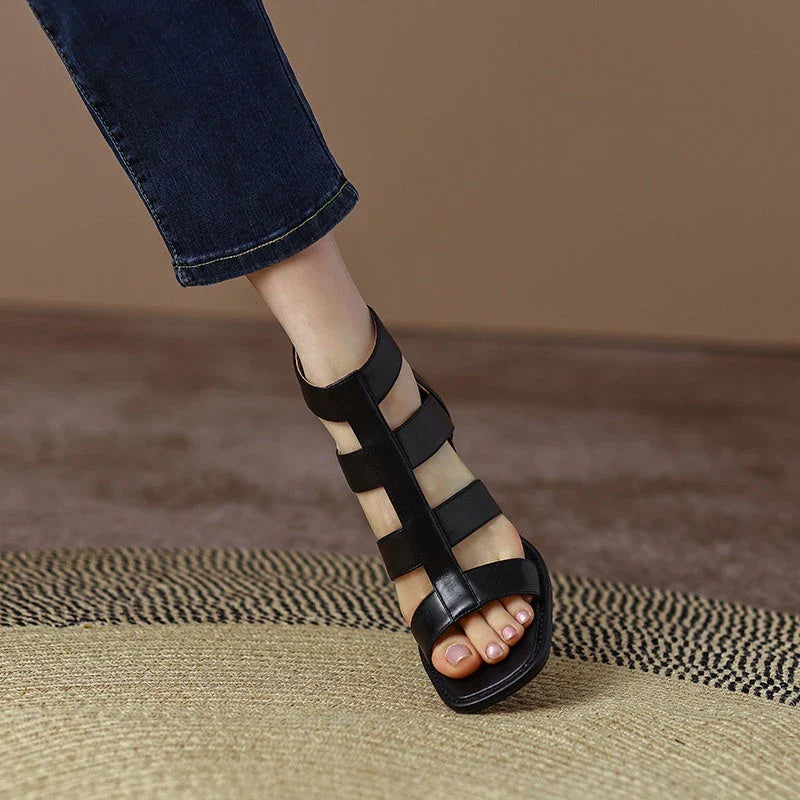 Luxurious leather gladiator sandals with square heel and buckle strap, providing style and comfort for any occasion.