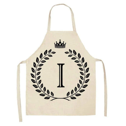 A high-quality kitchen apron featuring a charming crown and letter print design in a premium cotton and linen blend fabric.