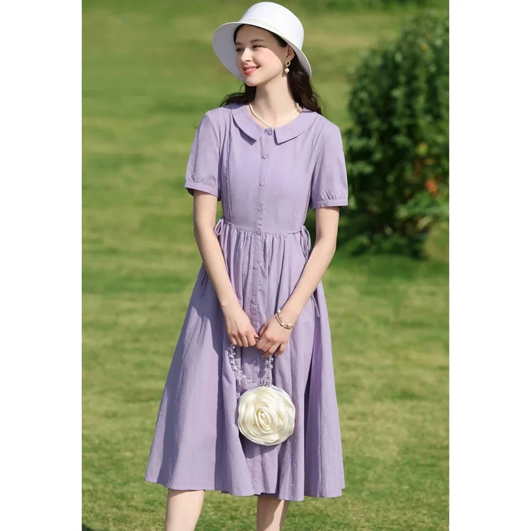 Sophisticated French-inspired short sleeve summer dress with puff sleeves, turn-down collar, and lace-up detailing
