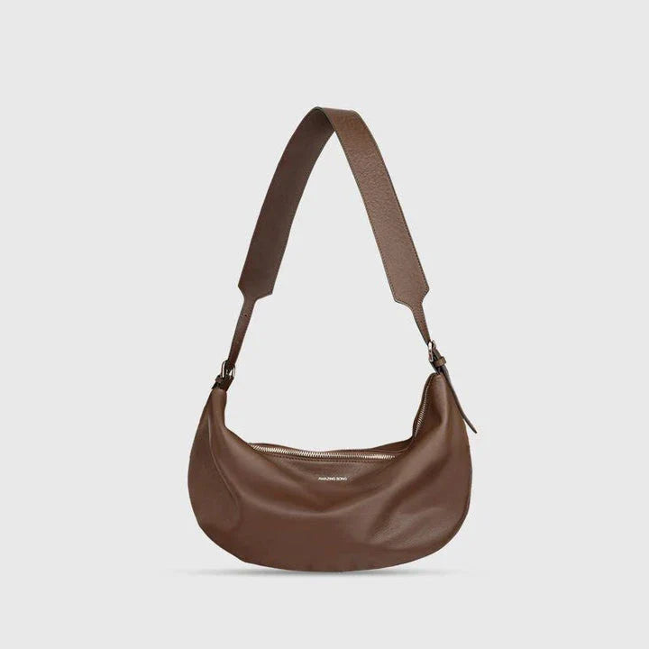 Stylish leather crossbody fanny pack with vintage half-moon design, perfect for everyday use in the UK