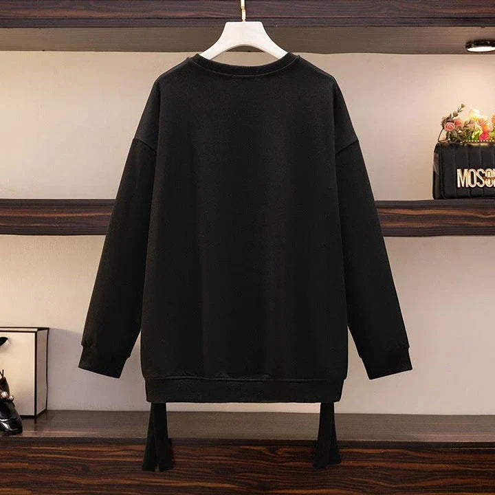 A premium ladies' round neck pullover in a versatile black colour, made from high-quality cotton for exceptional softness and comfort.