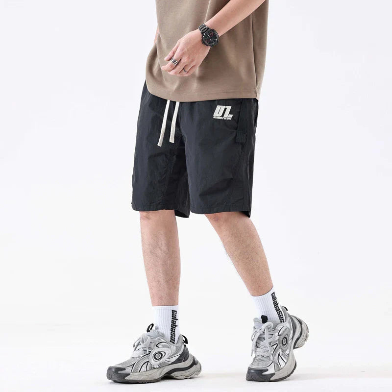 Premium Mountaineering Trousers in black and khaki colours, featuring a relaxed straight-leg fit and durable nylon construction for outdoor adventures.