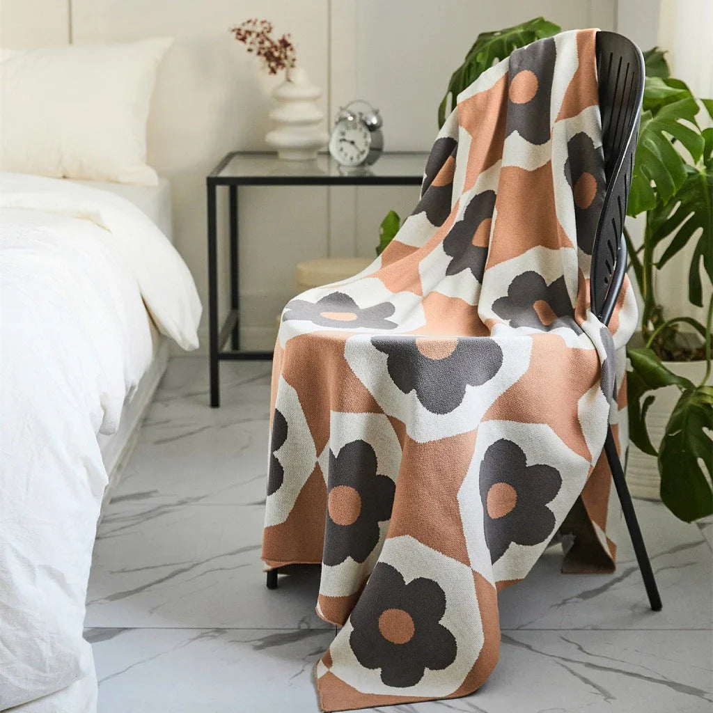 Floral knitted cotton throw blanket in a cosy Matcha Green colour, perfect for British homes and outdoor adventures.