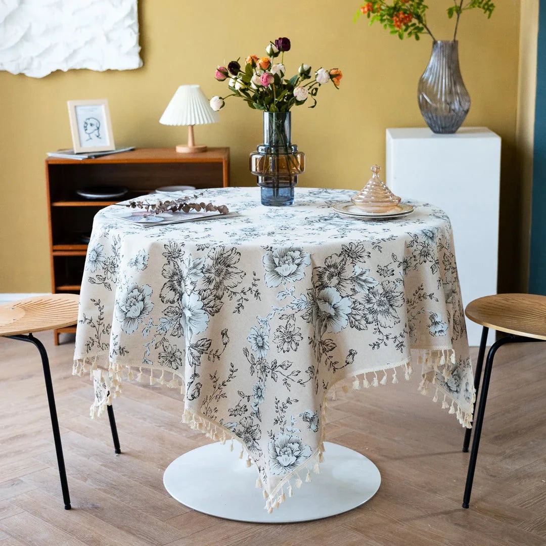 Elegant peony print cotton linen tablecloth with tassels, perfect for sophisticated home decor and dining experiences