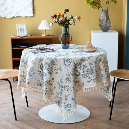 Elegant peony print cotton linen tablecloth with tassels, perfect for sophisticated home decor and dining experiences