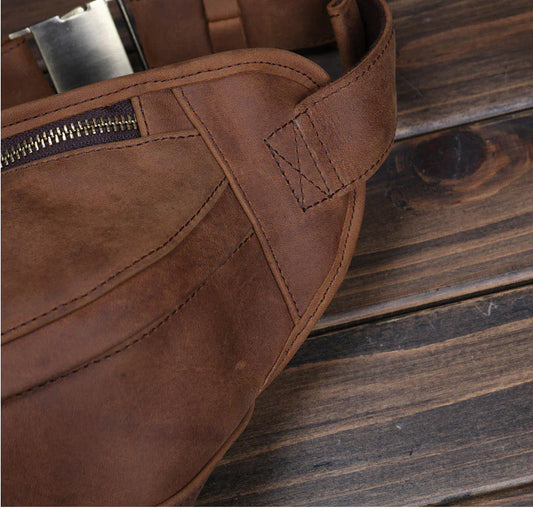 Premium British leather crossbody bag with adjustable strap and multiple pockets for organised storage