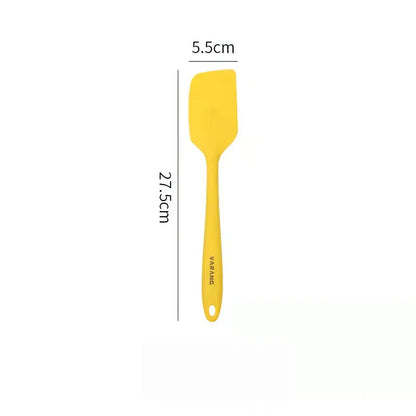 A set of two high-quality silicone spatulas in brown and yellow colours, designed for versatile cooking and baking tasks.