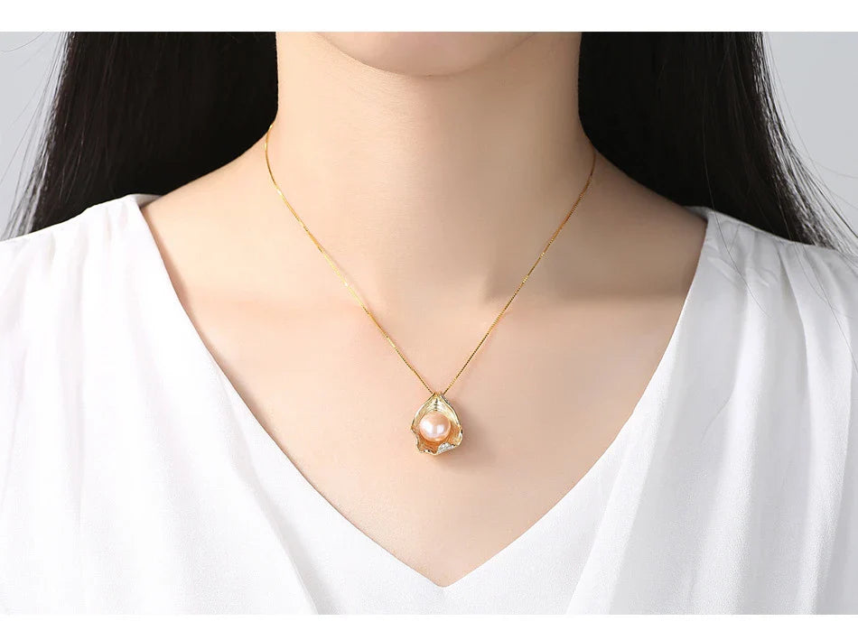 Elegant pearl pendant necklace with sterling silver setting, featuring a modern geometric design